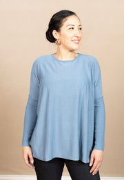 Round neck, boxy sweater with long, ribbed sleaves.