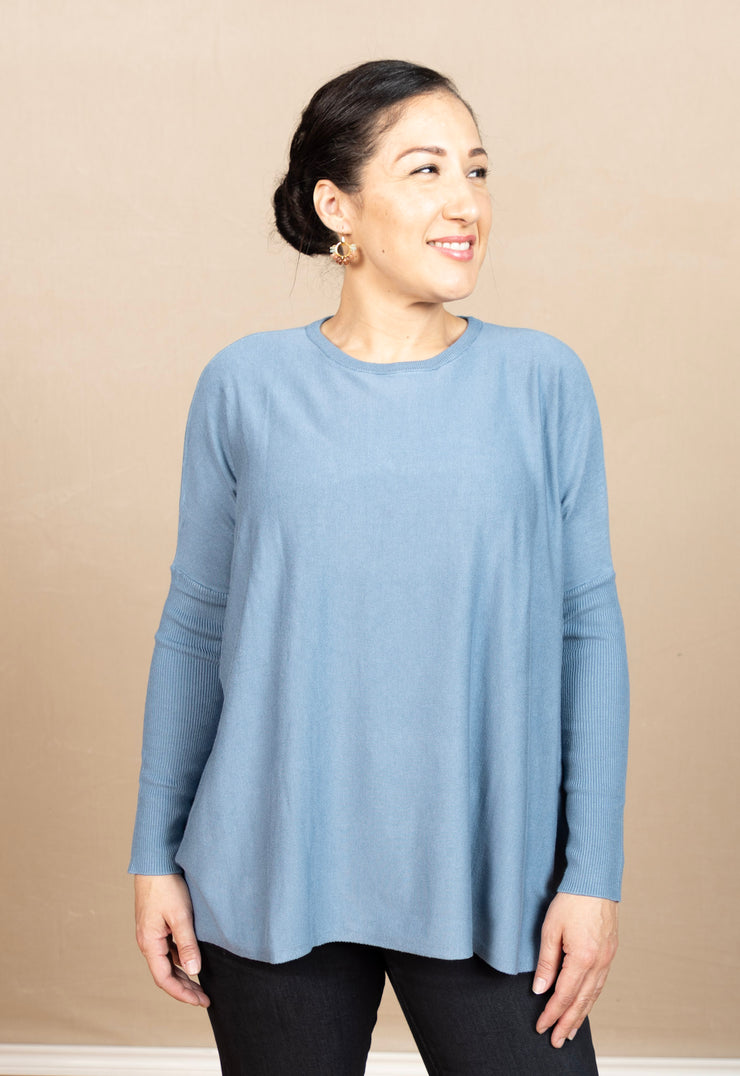 Round neck, boxy sweater with long, ribbed sleaves.