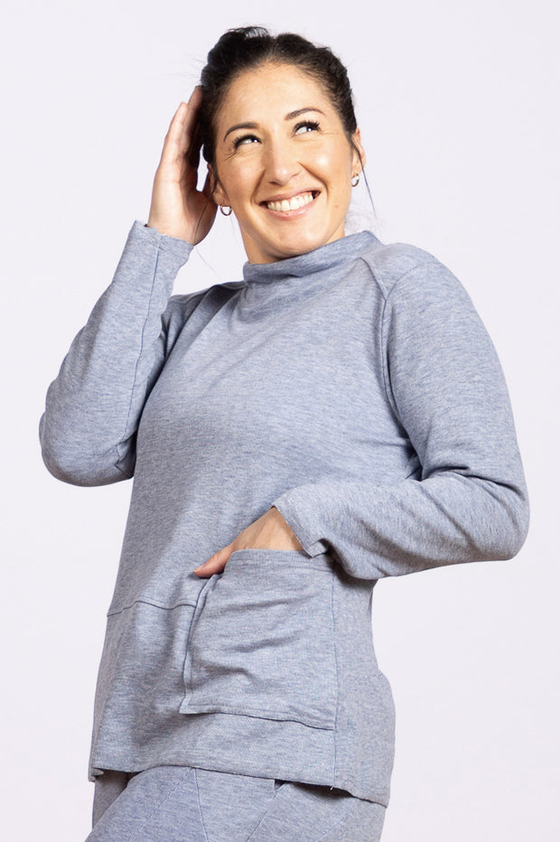 sky blue top with mock neck and pocket
