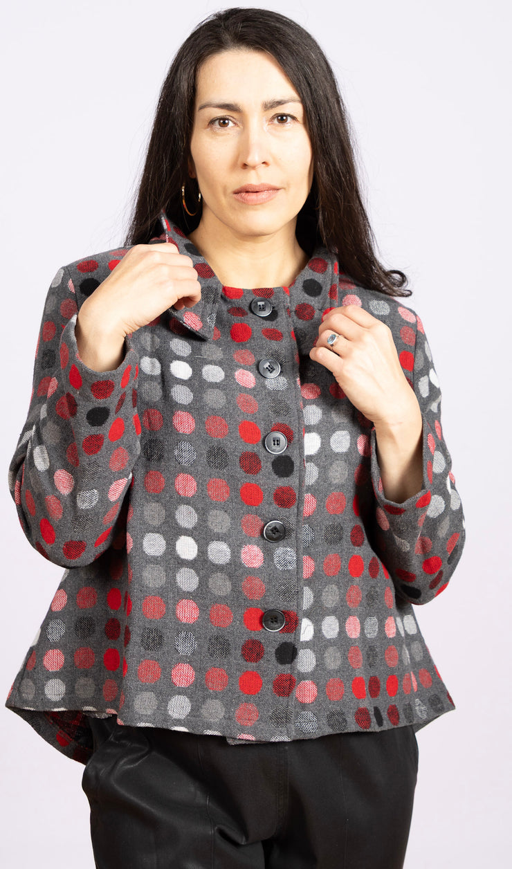 gray jacket with red and black dots