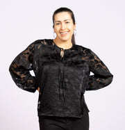 Davy Black,  slit at the neck with a tie, long sleeves with puff effect 