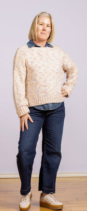 white sweater with purple, pink, gold, and orange specks
