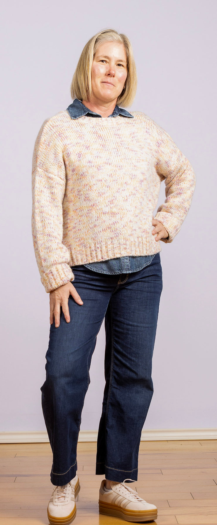 white sweater with purple, pink, gold, and orange specks
