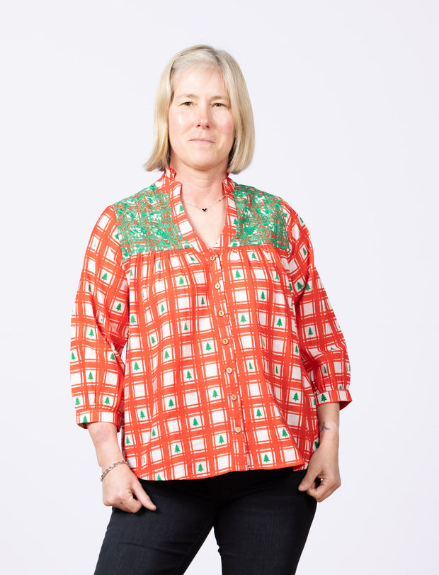 red and white plaid top with green embroidery
